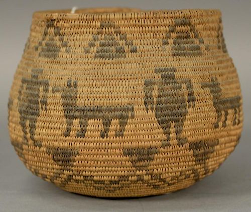 Coiled Indian basket with dog and man figures decoration.
ht. 5 1/2in., opening dia. 5 1/2in.