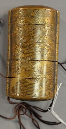 Japanese lacquered inro with gold landscape scene on each side.