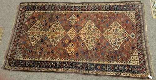 Caucasian Oriental area rug. 
5'4" x 9'