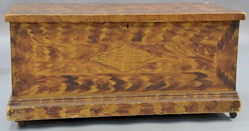 Primitive lift top blanket chest in original grain paint with plain molded base.  ht. 18in., top: 18" x 37"  Provenance:  Est