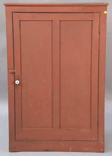 Primitive one door cupboard with recessed panels.  ht. 50in., wd. 32 1/2in., dp. 10in. Provenance:  Estate of Arthur C. Pinto