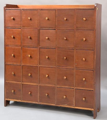 Spice cabinet having gallery top with twenty-five drawers set on boot jack ends.  ht. 50in., wd. 45in., dp. 12 1/2in. Provena