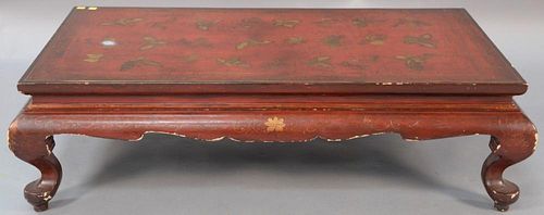 Chinese red lacquer gilt decorated low table, 20th century (extensive losses, especially at base of feet). 
ht. 12 1/2in., wd