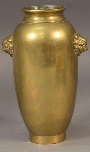 Chinese bronze vase with lion mask handles, signed on bottom. 
ht. 9in.