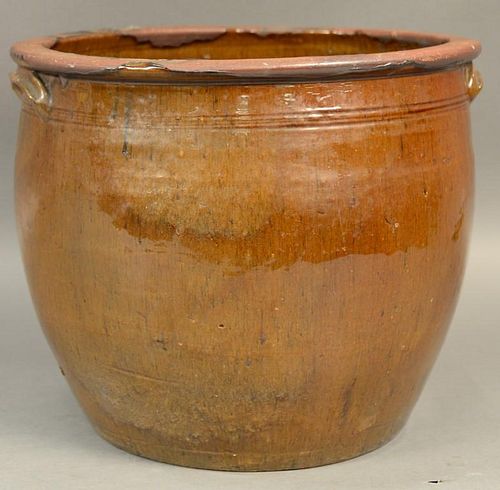 Large redware crock with two handles and brown glaze.  ht. 12in., dia. 14in. Provenance:  Estate of Arthur C. Pinto, MD