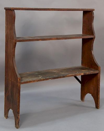 Pine bucket bench having three shelves on boot jack ends, 19th century, possibly Pennsylvania.  ht. 46 3/4in., wd. 41 1/2in.,