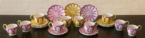 SET OF EIGHT MOTTAHEDEH TULIP-FORM CUPS AND TEN SAUCERS