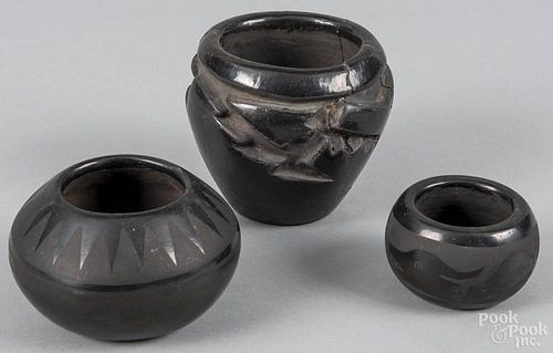Three pieces of Santa Clara blackware pottery, the largest signed Tafoya, the middle size, unsigne