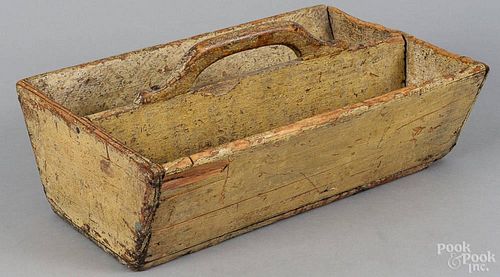 Painted pine utensil tray, 19th c., retaining an old mustard surface, 6'' h., 13 3/4'' w.
