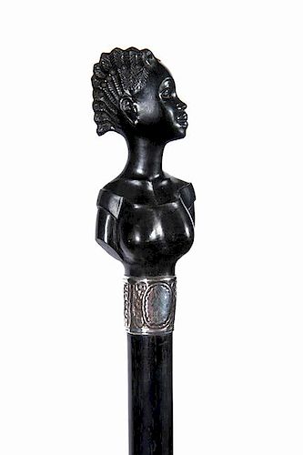 2. Ebony Black Lady- Early 20th Century- A carved ebony handle of an elegant black lady, ornate silver collar, exceptional eb