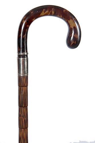 4. Shell Crook Dress Cane- Ca. 1925- A formed tortoise handle with an unreadable but tested 10kt gold collar and a small 10kt