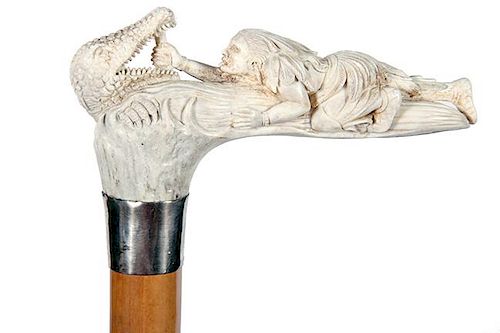 1. Stag Indian and Alligator Cane- Late 20th Century- A modern stag carving of an Indian holding an alligator’s mouth open 
