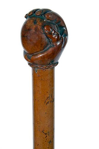 19. Hand and Ball Folk Cane- Ca. 1860- A very nicely carved hand and ball burl handle which is attached to a malacca shaft, a