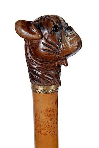 67. Pug Glove Holder Cane- Ca. 1890- A working lower-jaw which was used to hold gloves or smokes, a pair of glass eyes and so