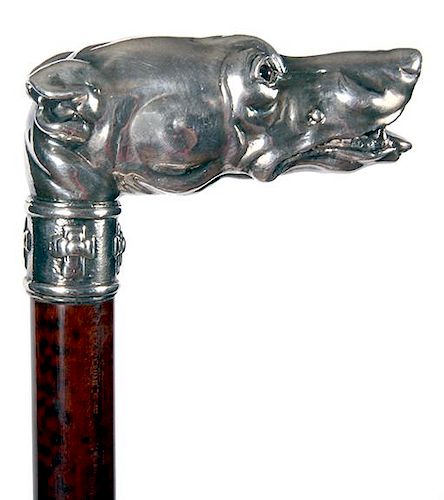 70. Silver Dog Cane- 20th Century- A cast silver dog with two color glass eyes, ornate silver collar, beautiful snakewood sha