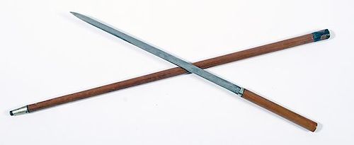 103. Japanese Sword Cane- Ca. 1925- A Japanese push-and-pull sword cane with a 16” blade, hardwood handle, painted metal co