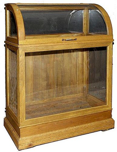 141. Oak Cane Case- Ca. 1900- A fine example in near mint condition, with 78 stick and ball dividers, stepped five tier base,