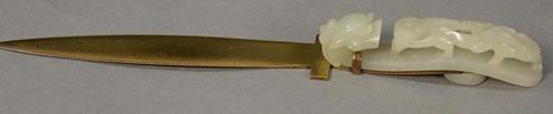 Jade belt buckle mounted as a letter opener handle having relief carved jade dragon. 
buckle lg. 3 1/2in., total lg. 6in.
