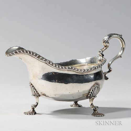 George III Sterling Silver Sauceboat, London, 1765-66, lacking or worn maker's mark, with gadrooned rim and scrolled handle o