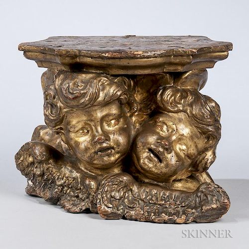 Italian Giltwood Putto Figural Wall Bracket, 19th century, two Baroque-style carved figural heads with wings surmounted by a 