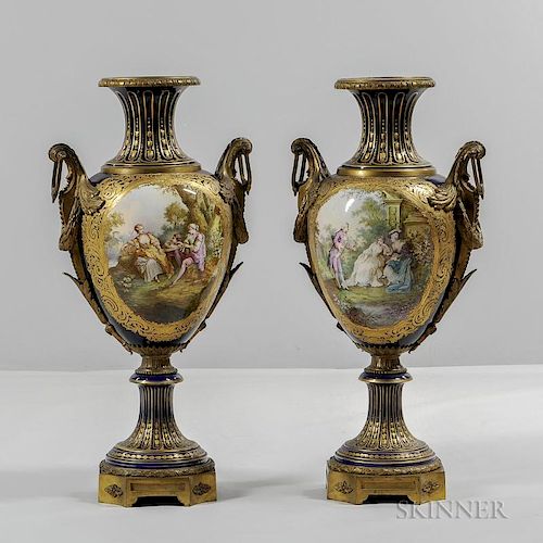 Pair of Sevres-style Porcelain Vases, late 19th century, each cobalt ground with gilding, trumpet-form neck over baluster for