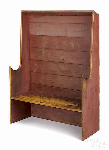 New England painted pine settle bench, 20th c., retaining a red stained surface, 63'' h., 49 3