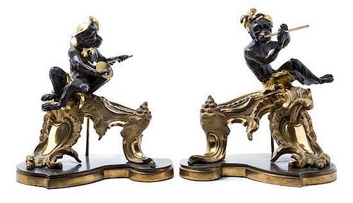 A Pair of Louis XV Style Gilt and Patinated Bronze Figural Chenets Height 14 inches.