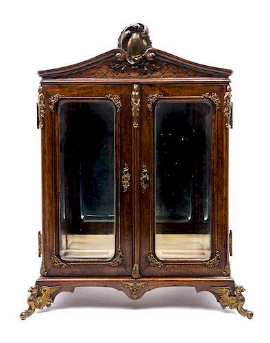 A French Gilt Metal Mounted Walnut Table Vitrine EARLY 20TH CENTURY Height 15 3/8 x width 10 3/8 x depth 7 3/4 inches.