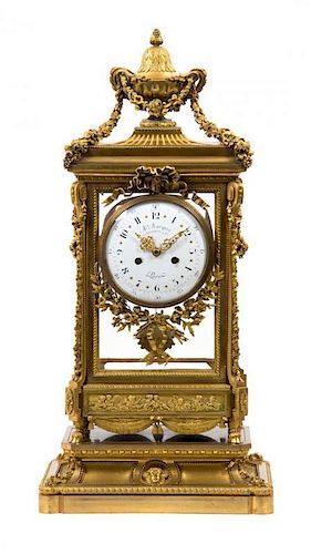 A Napoleon III Gilt Bronze Mantel Clock and Stand MAISON MARQUIS, MOVEMENT BY LANGUEREAU, PARIS, 19TH CENTURY Height overall 35