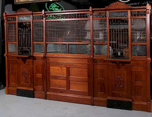 Victorian bank teller cage, a beautiful stick and ball golden oak cage with fancy applied carving and bronze bars, all of fro