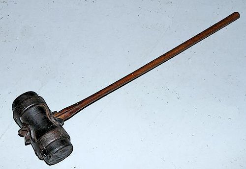 Carnival strength hammer, circa 1900, overall length 36", the hammer head is made of metal and leather to make ringing the be