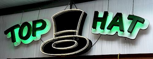 Neon "Top Hat" sign, Hat is white neon 50" x 52", accompanying  Top Hat lettering 27" x 54" is back-lit with green neon