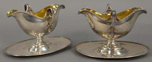 Pair of Lazarus Posen silver gravy boats with gold wash interior bowl, marked L. Posen 800.38384. ht. 5 1/4in., lg. 8 1/2in.,