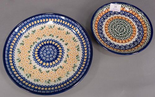 Setting for twelve, handmade Polish pottery dinner and luncheon plates, hand painted and marked Made in Poland, most signed, 