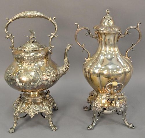Two silverplate hot water pots, one with bird finial. ht. 16 1/2in. & ht. 17in.