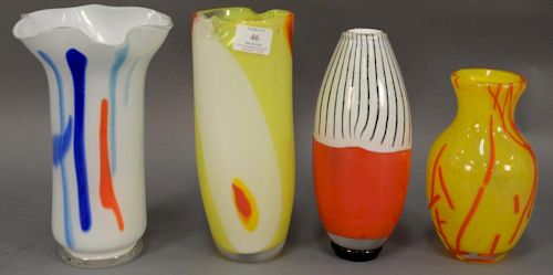 Group of four art glass Murano vases including yellow with orange splash, red and white ground with black, yellow, and white 