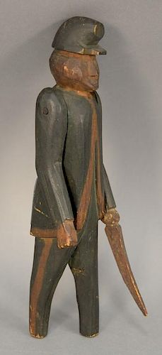Carved folk art figure of soldier with sword (movable arms). ht. 9 1/2in.