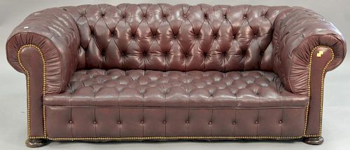 Leather Chesterfield style loveseat with tufted seat and back. wd. 70in.