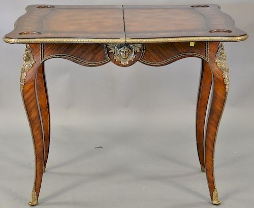 Louis XV style game table, opening to leather playing surface and coin depressions surrounded by inlays. ht. 31in., lg. 34in.