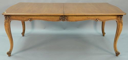 French Louis XV style dining table with one large 27inch leaf. ht. 29in., lg. 78in., wd. 45in., opens to 105in.