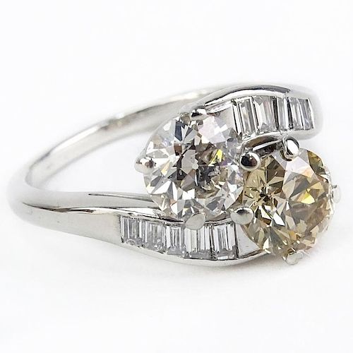 Art Deco Approx. Diamond and Platinum Bypass Ring set with an Approx. 1/32 Carat Round Brilliant Cut Fancy Brownish Yellow Di