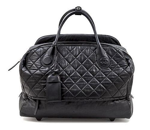 A Chanel Black Quilted Weekender Roller Bag, 19" x 13.5" x 8.5".