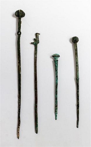 * A Group of Four Ancient Bronze Hair or Cloak Pins Length of longest 6 1/2 inches.