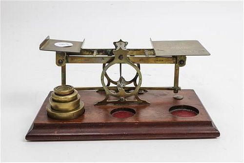 * An English Brass Postal Scale, S. Mordan Width 9 1/2 inches.