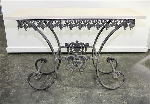 A French Iron and Marble Baker's Table Height 33 x width 46 x depth 16 3/4 inches.