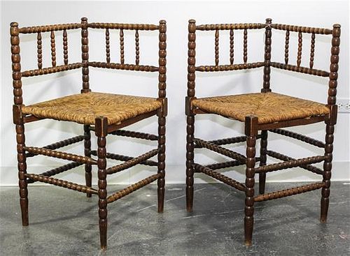 A Pair of American Rush Seat Corner Chairs Height 31 3/4 x width 16 3/4 x depth 16 3/4 inches.