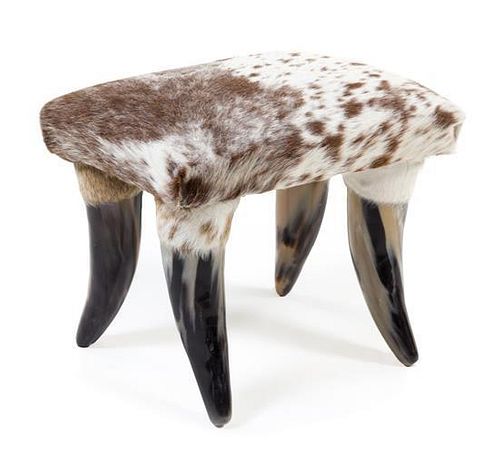 A Cow Hide and Horn Ottoman