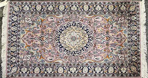 A Persian Wool and Silk Carpet