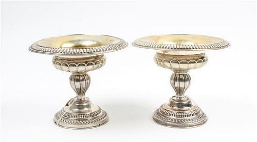 A Pair of Continental Silver Compotes, , each having a fluted rim and body surmounting a baluster form standard and raised on