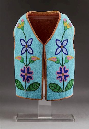 A Blackfeet Beaded Child's Vest Height approximately 16 inches